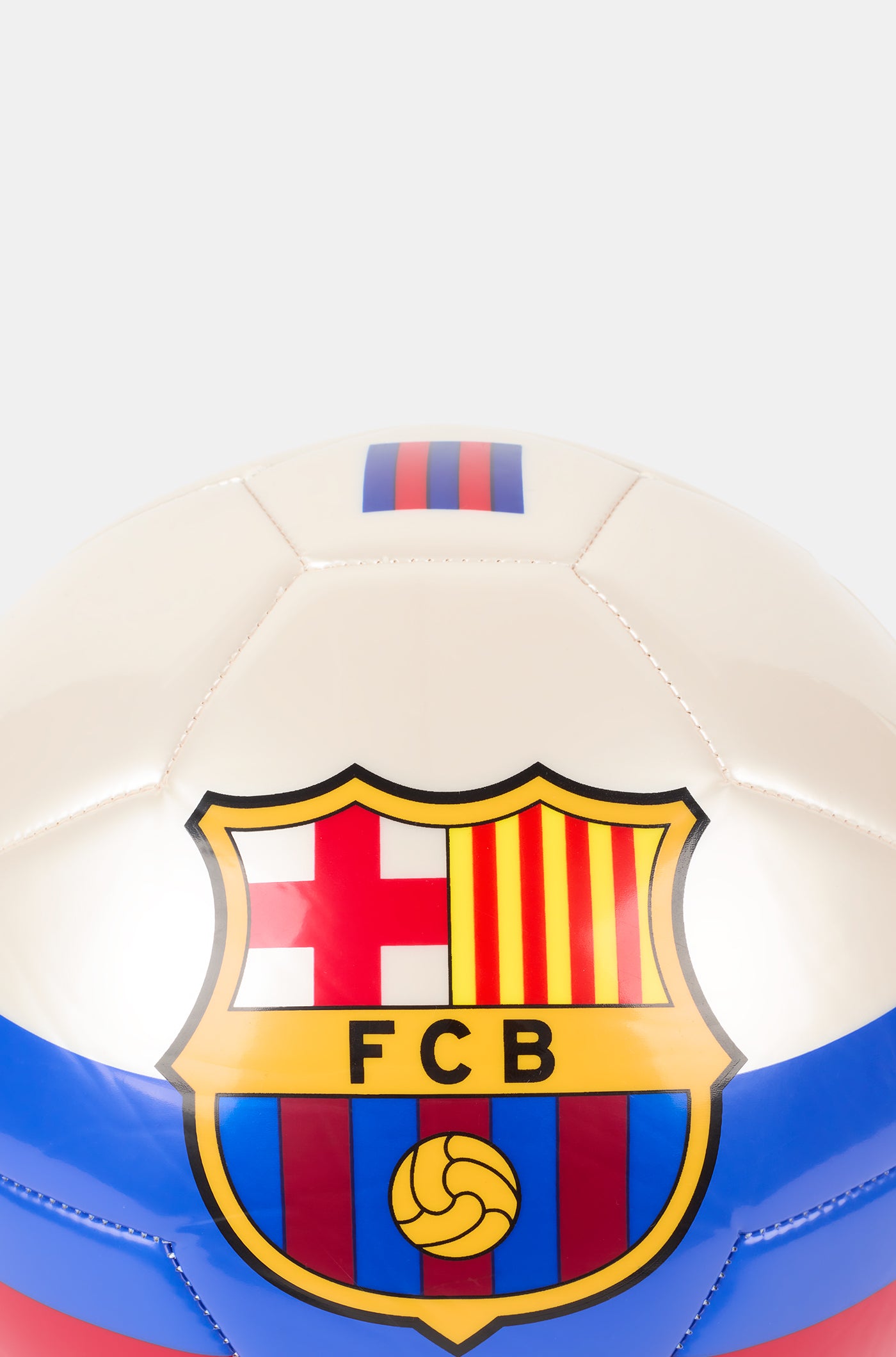 White football with blue and red stripes, featuring a large FC Barcelona crest in the center