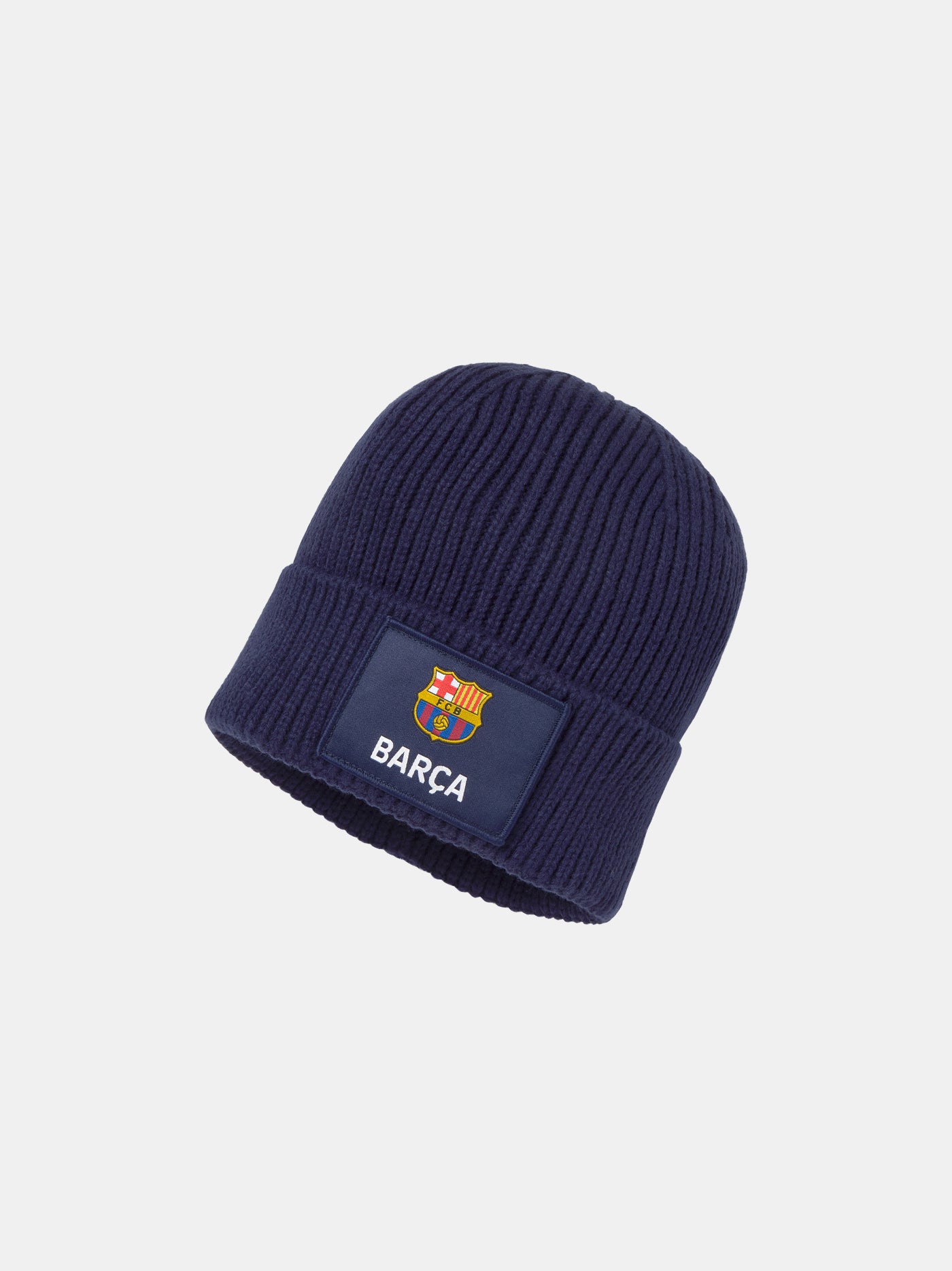 Dark blue knit beanie with a patch featuring the FC Barcelona crest and the word 'BARÇA' embroidered in white.