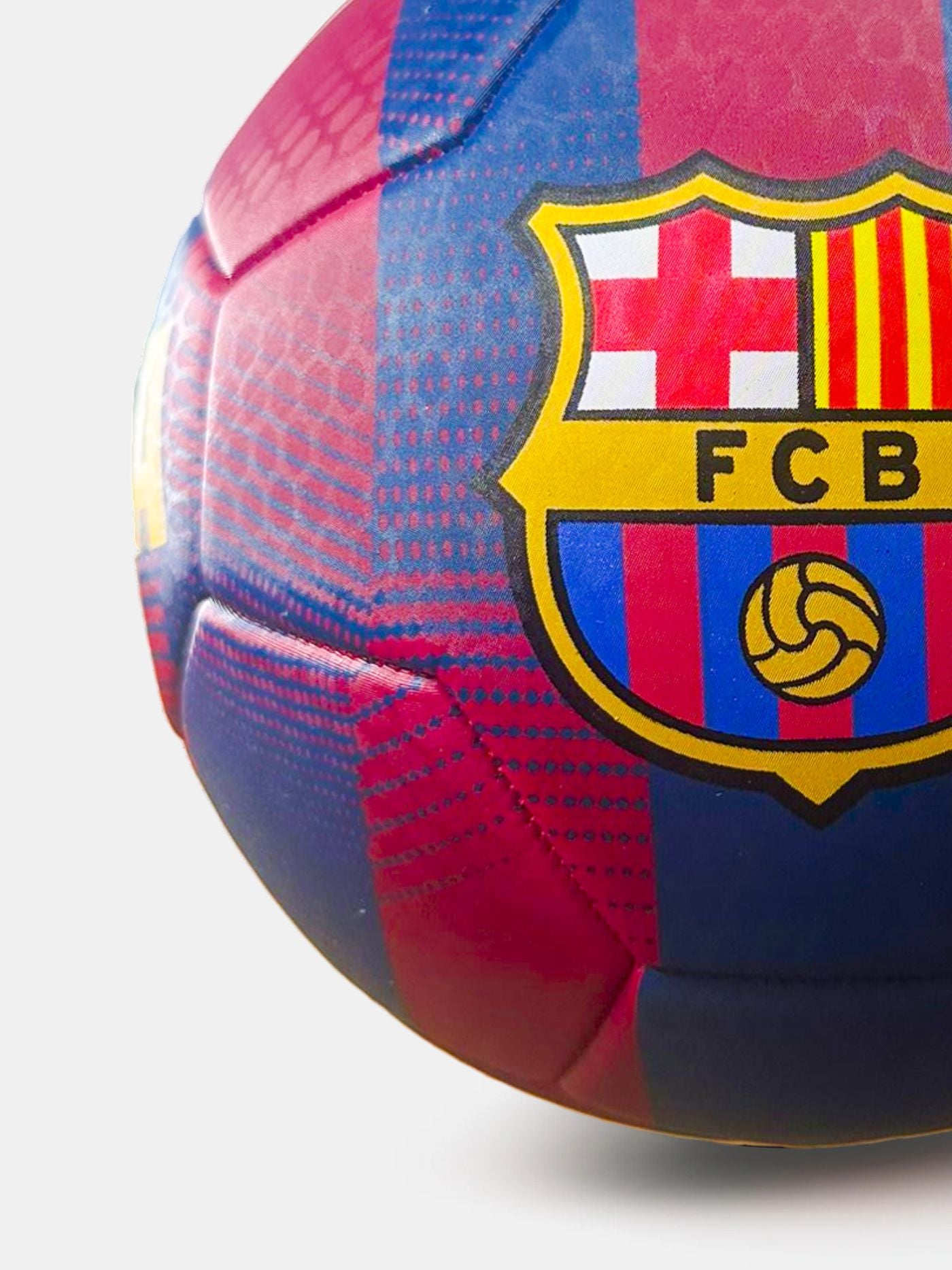 Red and blue soccer ball with FC Barcelona logo on a white background