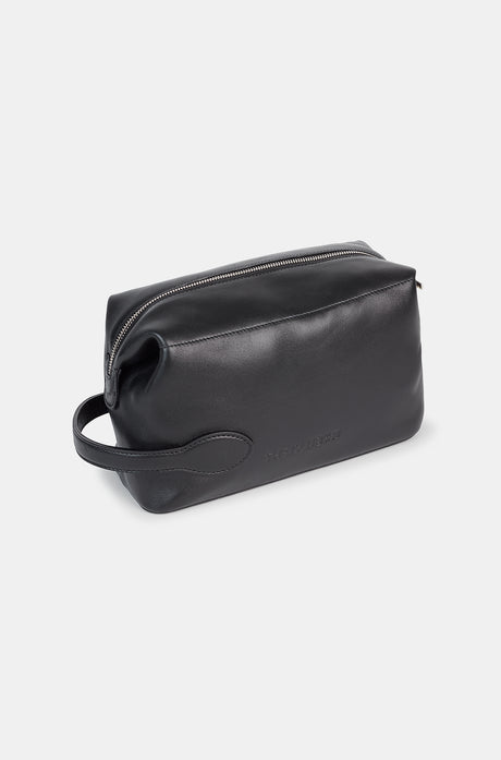 Black leather toiletry bag with a side handle and a silver zipper, featuring an embossed FC Barcelona logo.