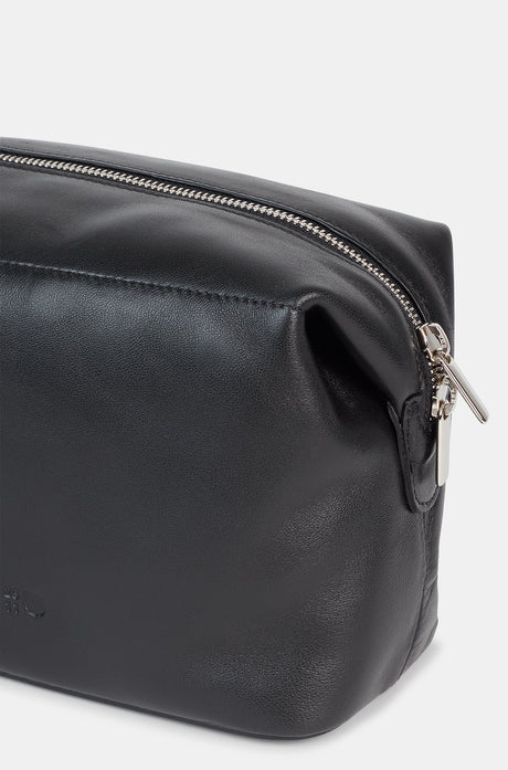 Black leather toiletry bag with a side handle and a silver zipper, featuring an embossed FC Barcelona logo.