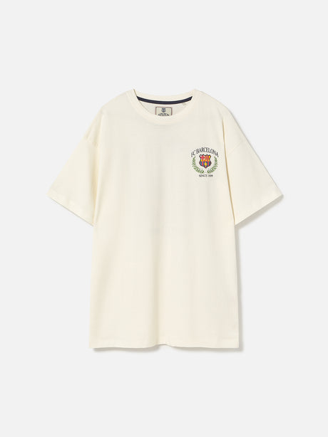 Cream T-shirt with large FC Barcelona stadium graphic, laurel wreath design, and 'FC Barcelona Since 1899' text on the back