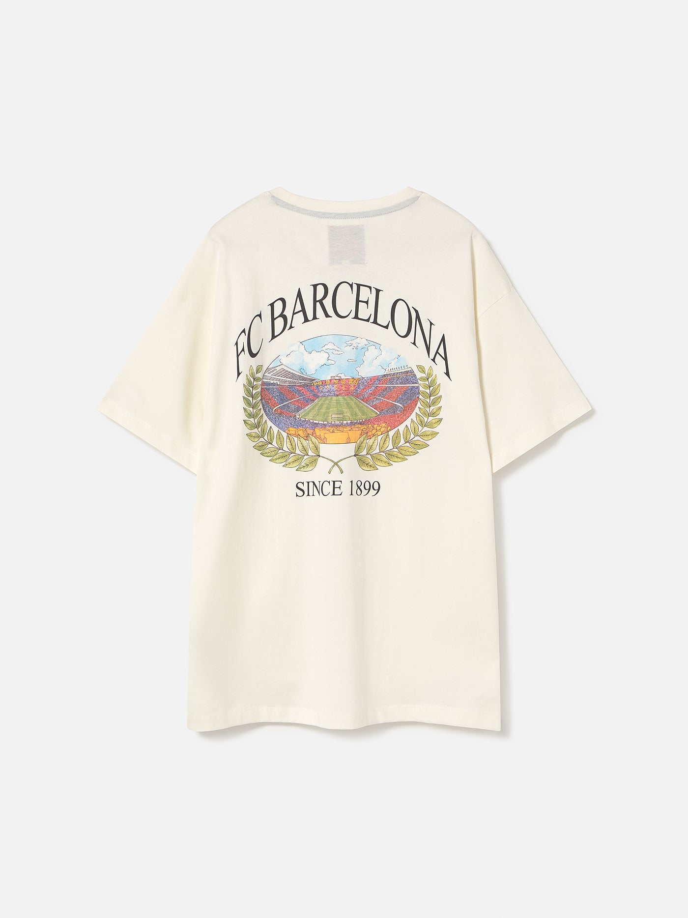 Cream T-shirt with large FC Barcelona stadium graphic, laurel wreath design, and 'FC Barcelona Since 1899' text on the back