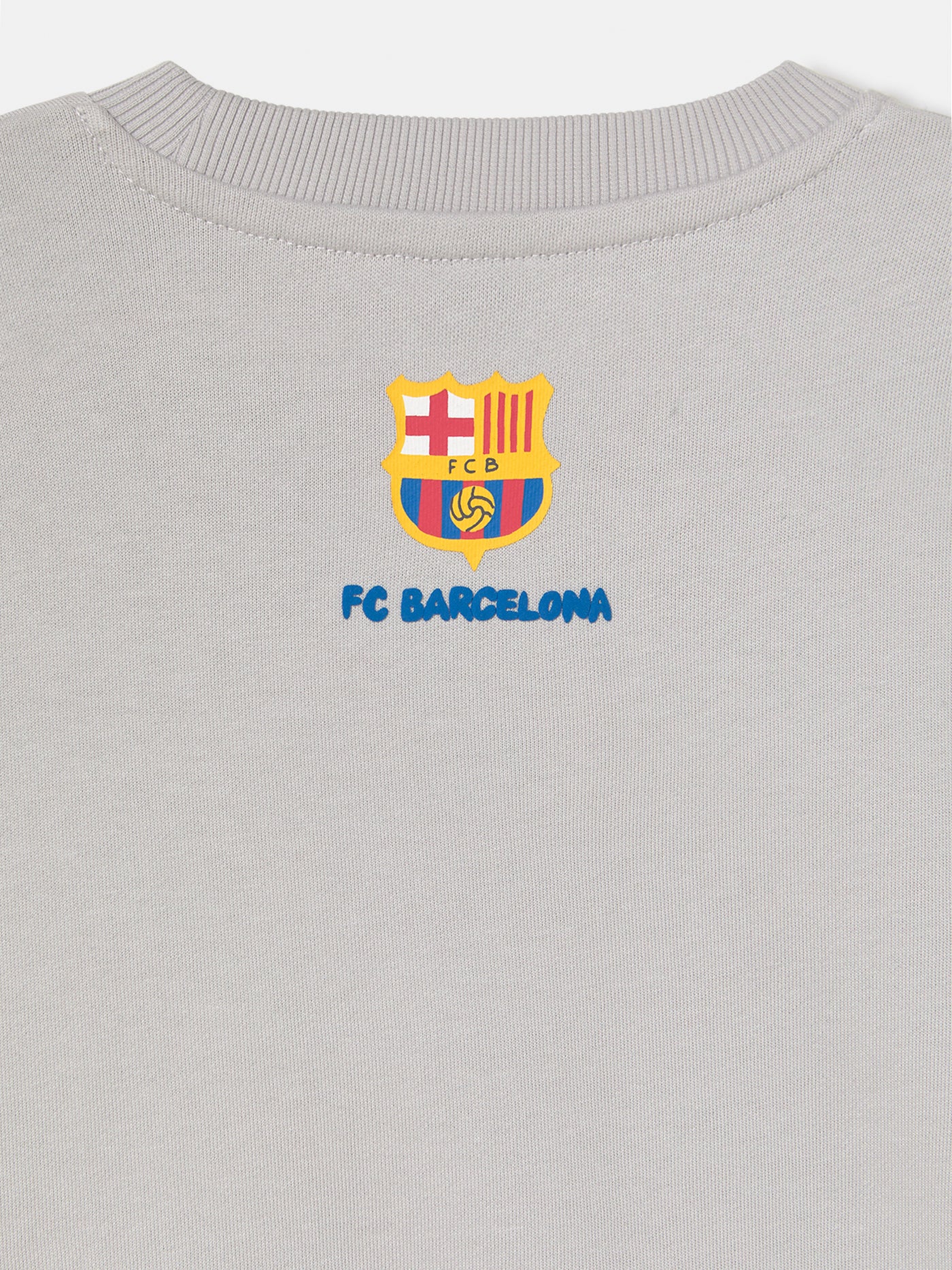 light grey FC Barcelona sweatshirt with a cartoon footballer and the word 'Barça' in blue