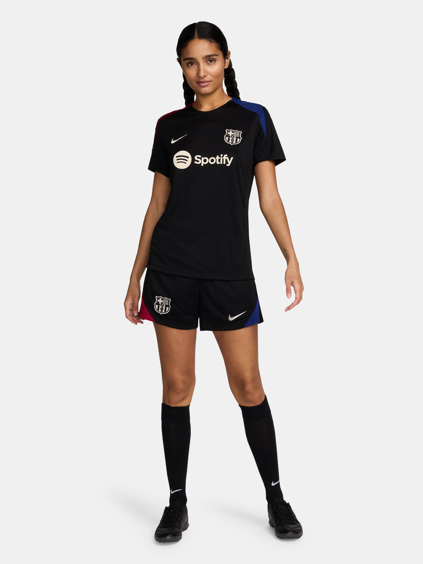 FC Barcelona black shorts with white crest, Nike logo, and red-blue side accents.