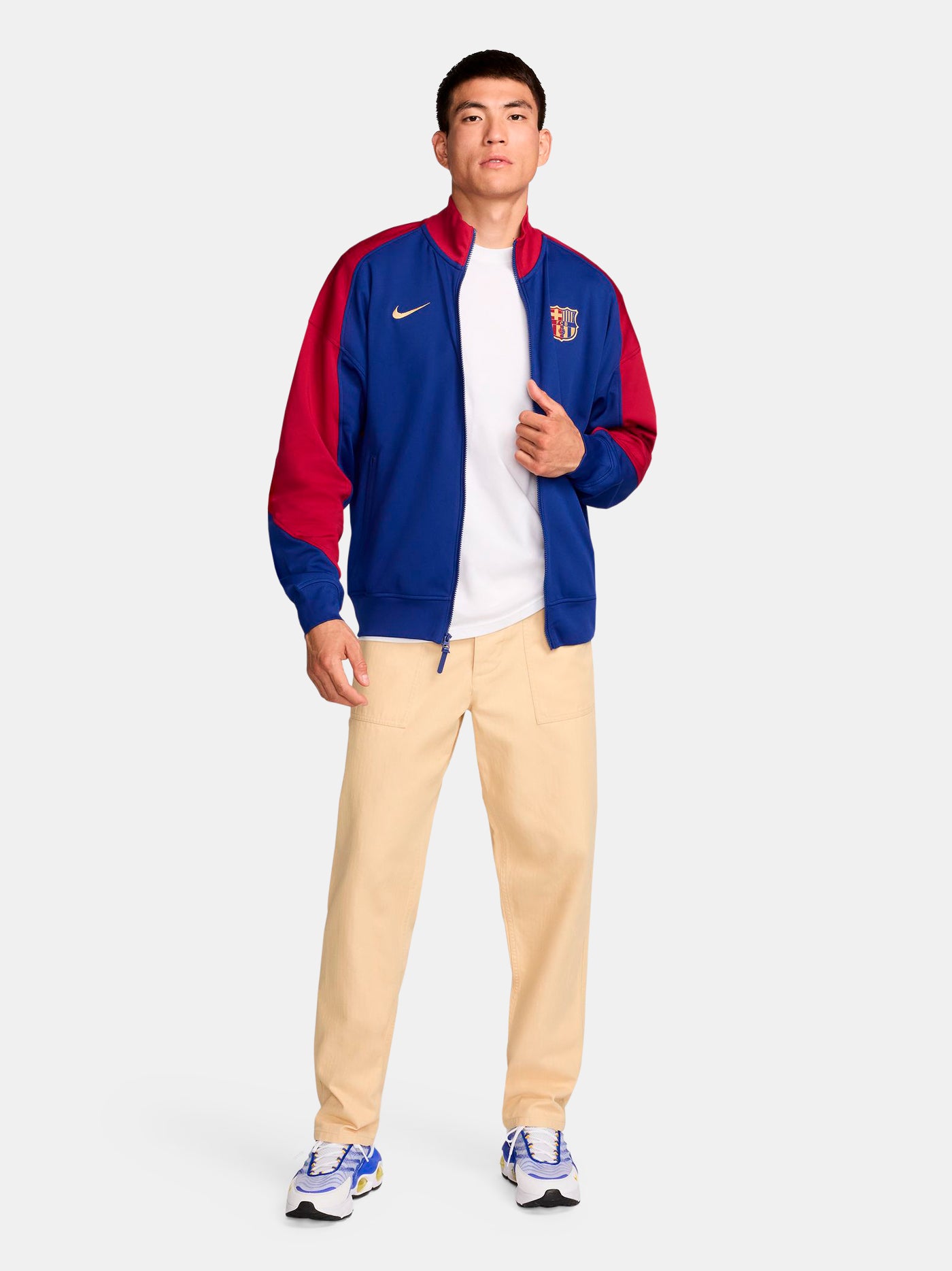FC Barcelona retro-style jacket in blue and red with gold Nike logo and crest.