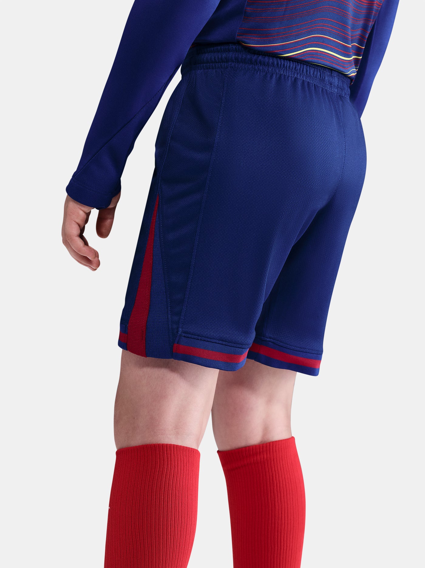 Classic Barça shorts in deep navy with red accents and yellow swoosh. Game-ready essentials.
