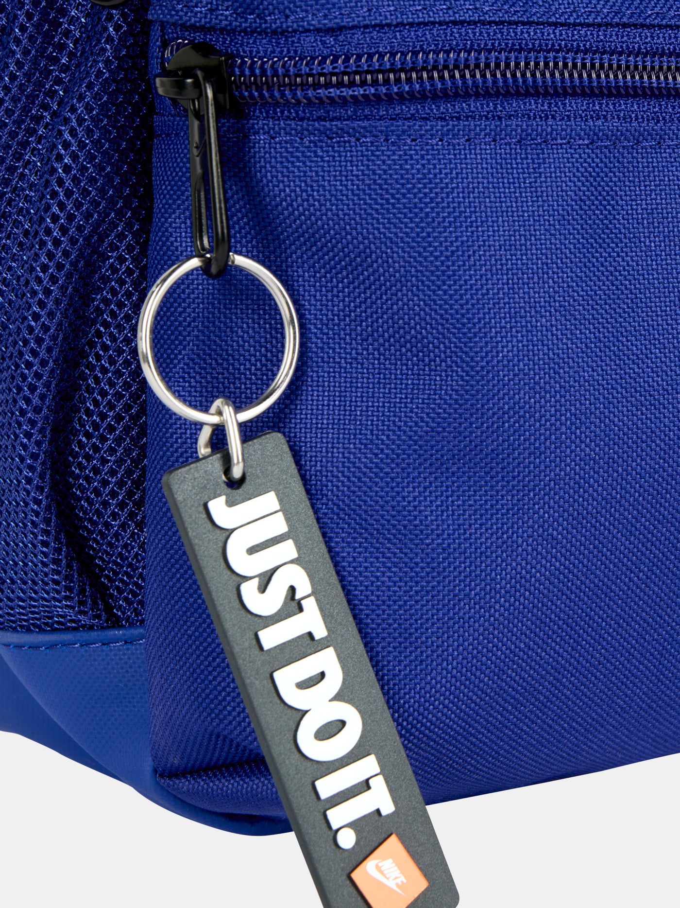 Mini FC Barcelona backpack in bold royal blue, featuring the Barça crest and yellow Nike swoosh on the front. Includes a front zip pocket, side mesh compartments, and a top handle. Finished with a black “JUST DO IT.” tag for a sporty touch.