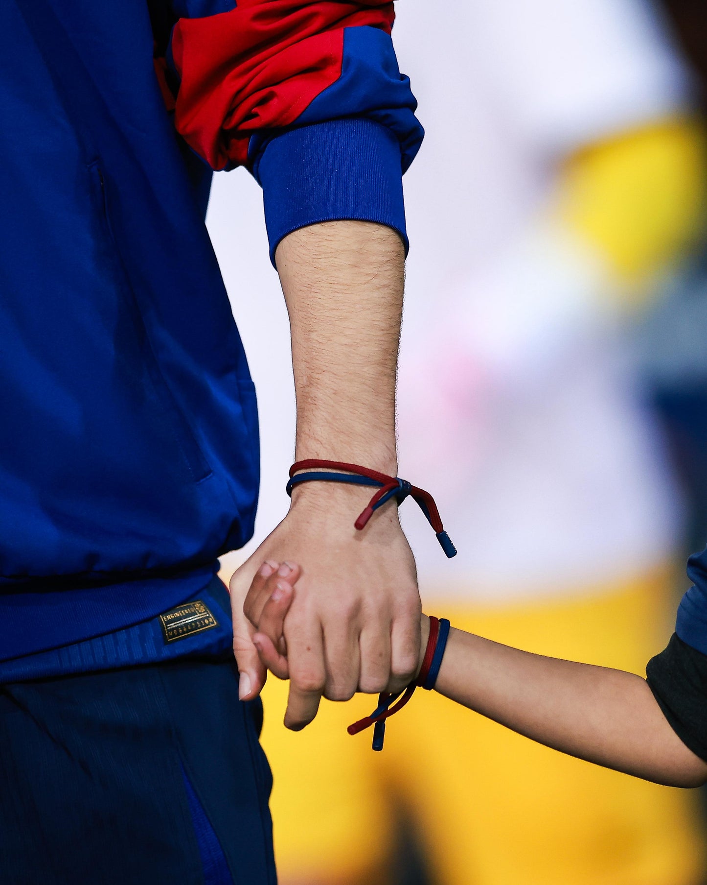 Braided bracelet in classic FC Barcelona colors—deep blue and vibrant red—featuring a subtle yet bold contrast that reflects the club’s identity. The design includes a small clasp or knot detail in the center, reinforcing the sporty and casual aesthetic. It's a minimal but expressive accessory, perfect for fans who want to wear their passion in a subtle, stylish way.