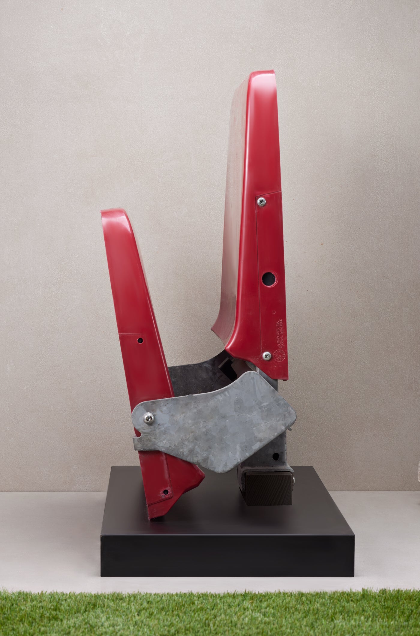 Original red stadium seat from Spotify Camp Nou mounted on a black display base with commemorative plaque.