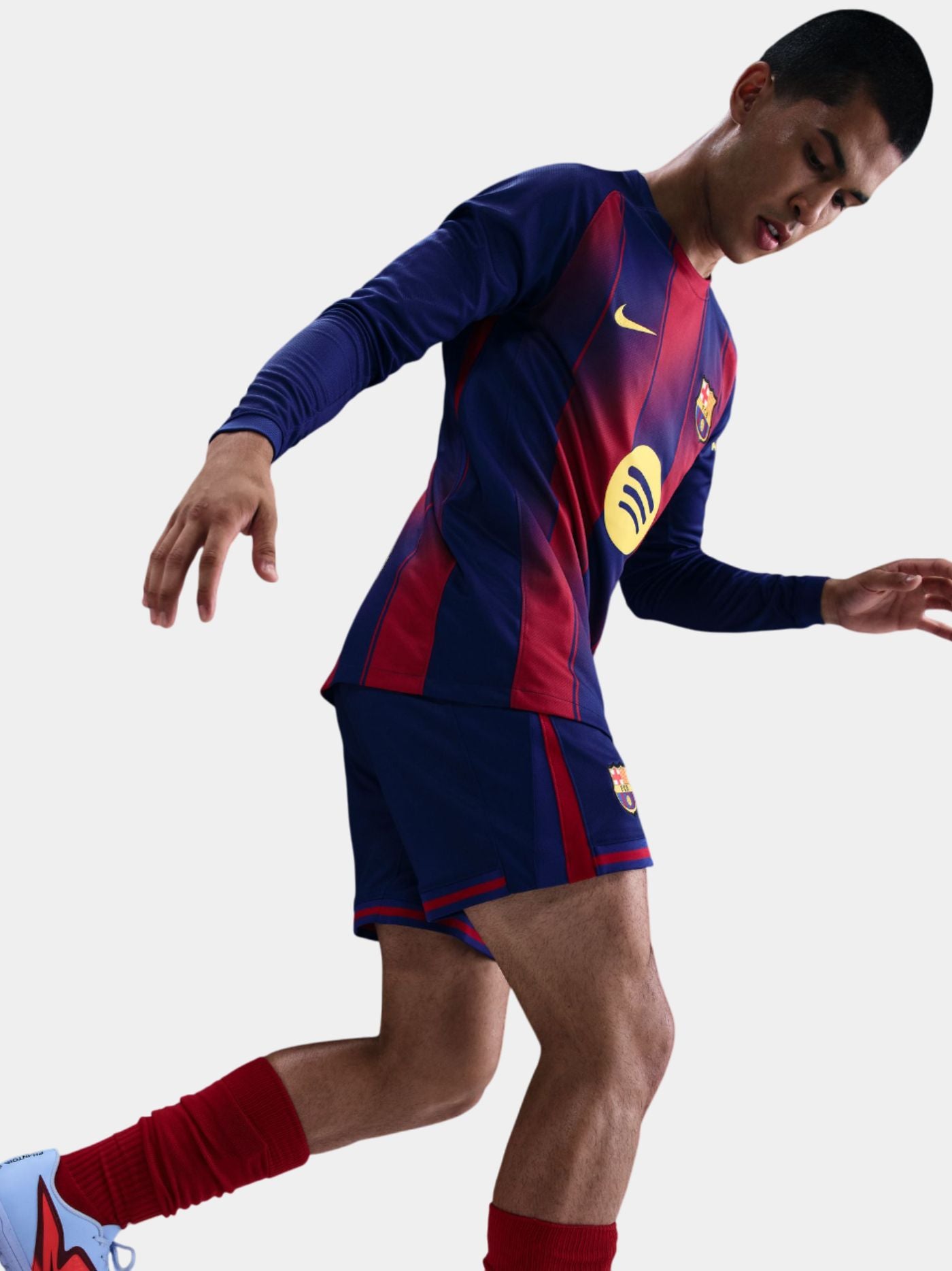 Person wearing a blue and red sports jersey with a Nike logo on a white background