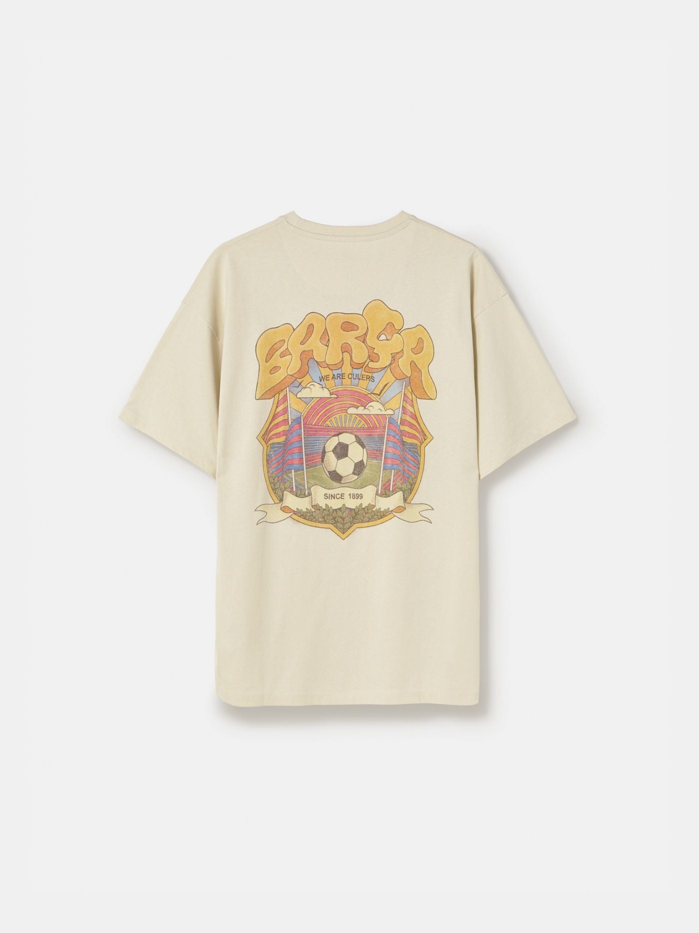Beige FC Barcelona T-shirt featuring a vibrant vintage-style back print with the word "Barça" in large retro bubble letters. The graphic includes a football, flags, and stadium elements in bold colors within a shield-like frame. A ribbon below the design reads “Since 1899” and “Més que un club.”