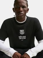 Person wearing a black sweatshirt with a logo and text on a white background