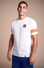 White T-shirt with FC Barcelona crest on the chest, Catalan flag detail on the sleeve, and red number 9 on the back.