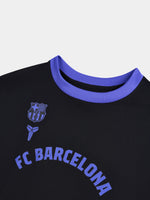 Black FC Barcelona t-shirt with purple accents, featuring the club crest and Kobe Bryant logo on the chest, along with 'FC Barcelona' text in purple across the front