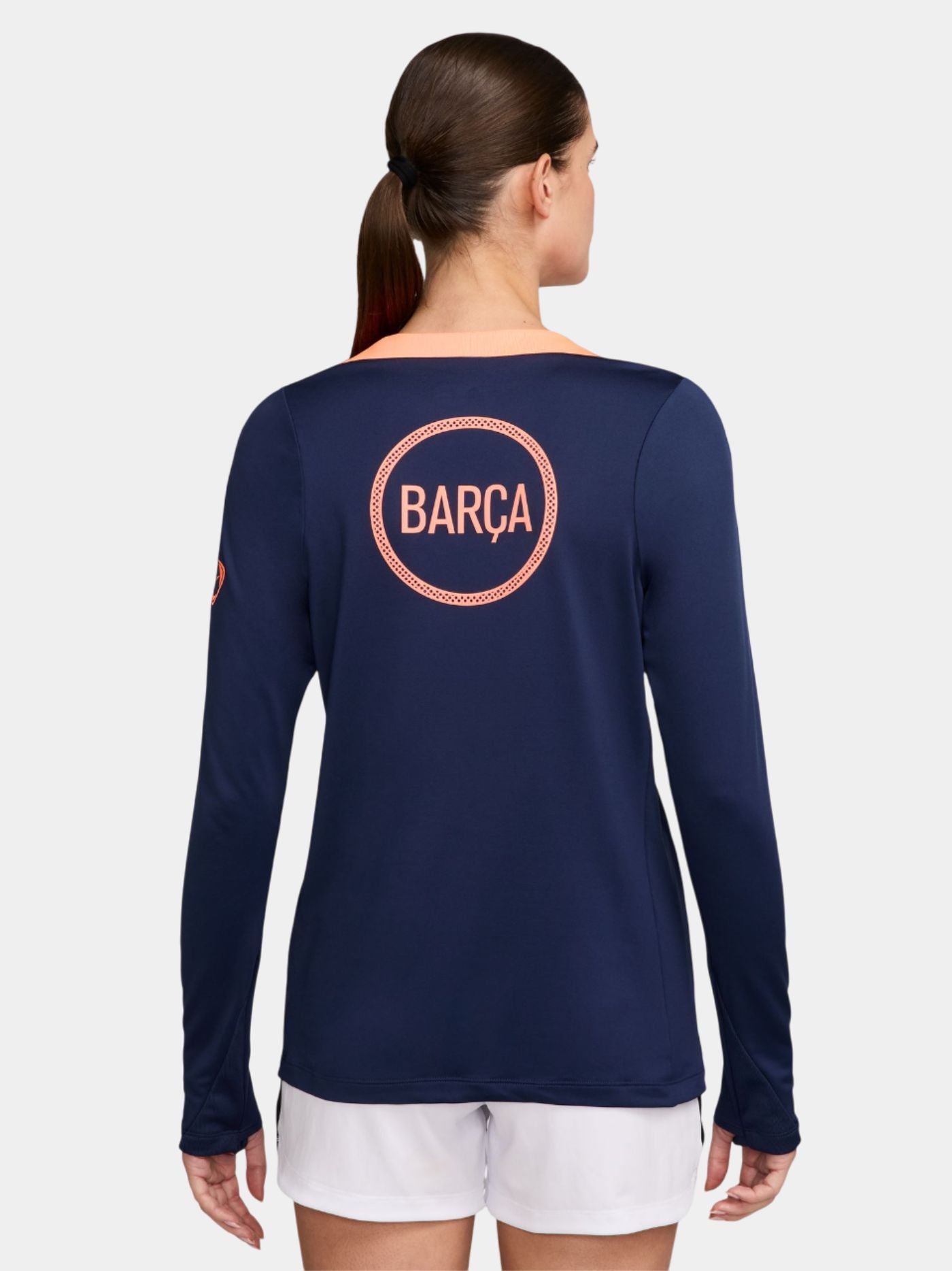 navy FC Barcelona jersey with coral geometric design, featuring the club crest, Nike logo, and Spotify sponsor.