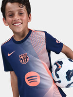 navy FC Barcelona jersey with coral geometric design, featuring the club crest, Nike logo, and Spotify sponsor.