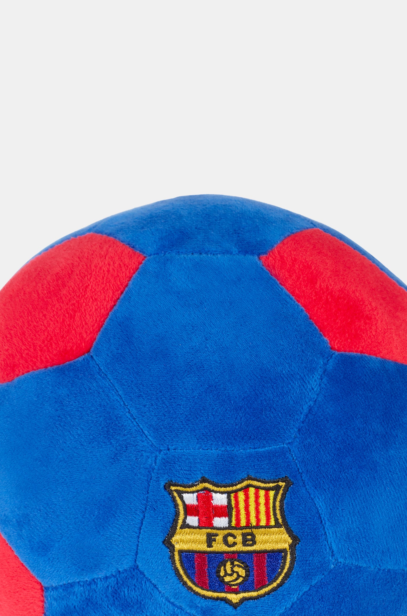 Soft plush football in blue and red with the FC Barcelona crest embroidered on the front.