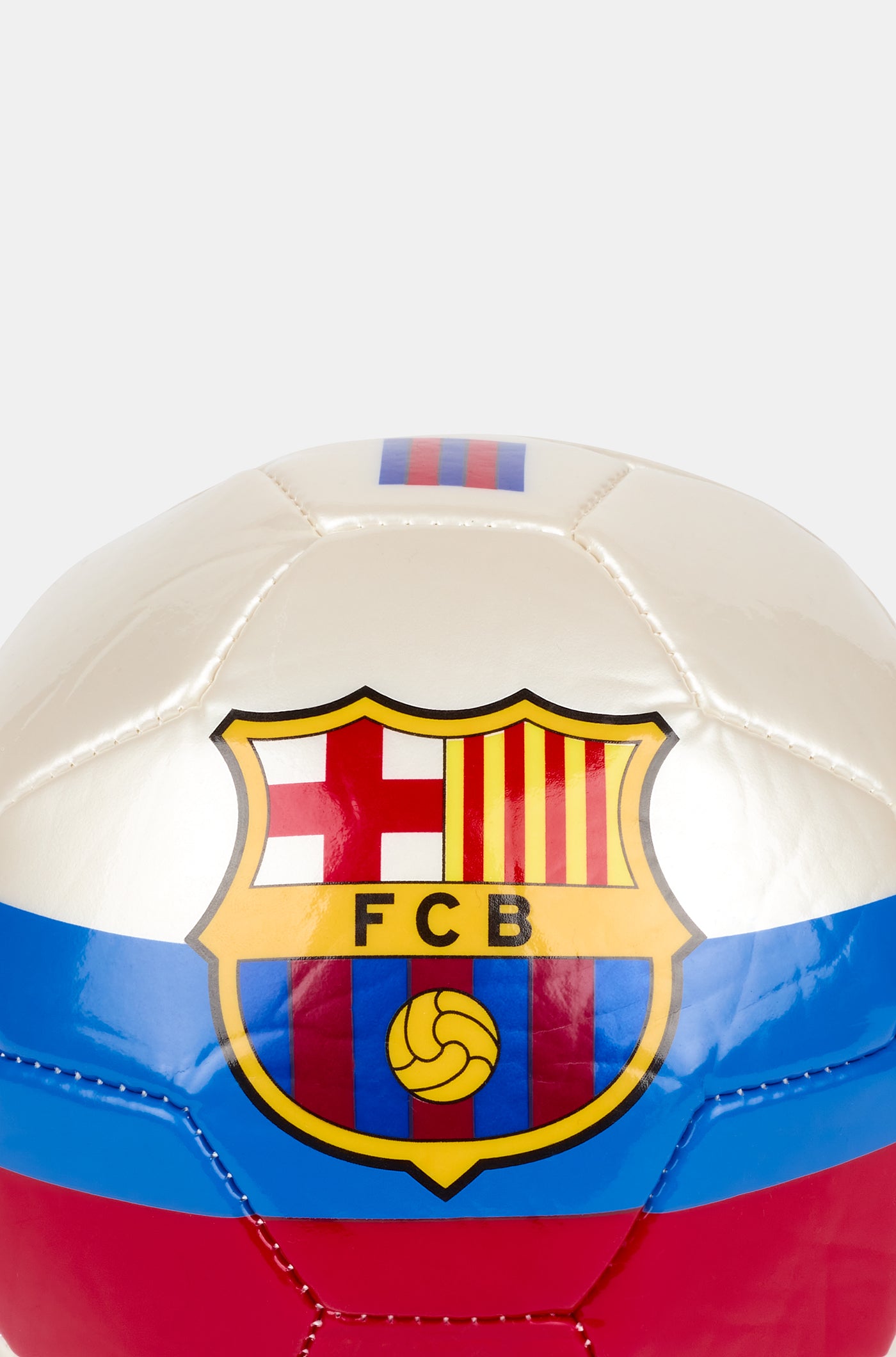 White football with blue and red stripes, featuring a large FC Barcelona crest in the center