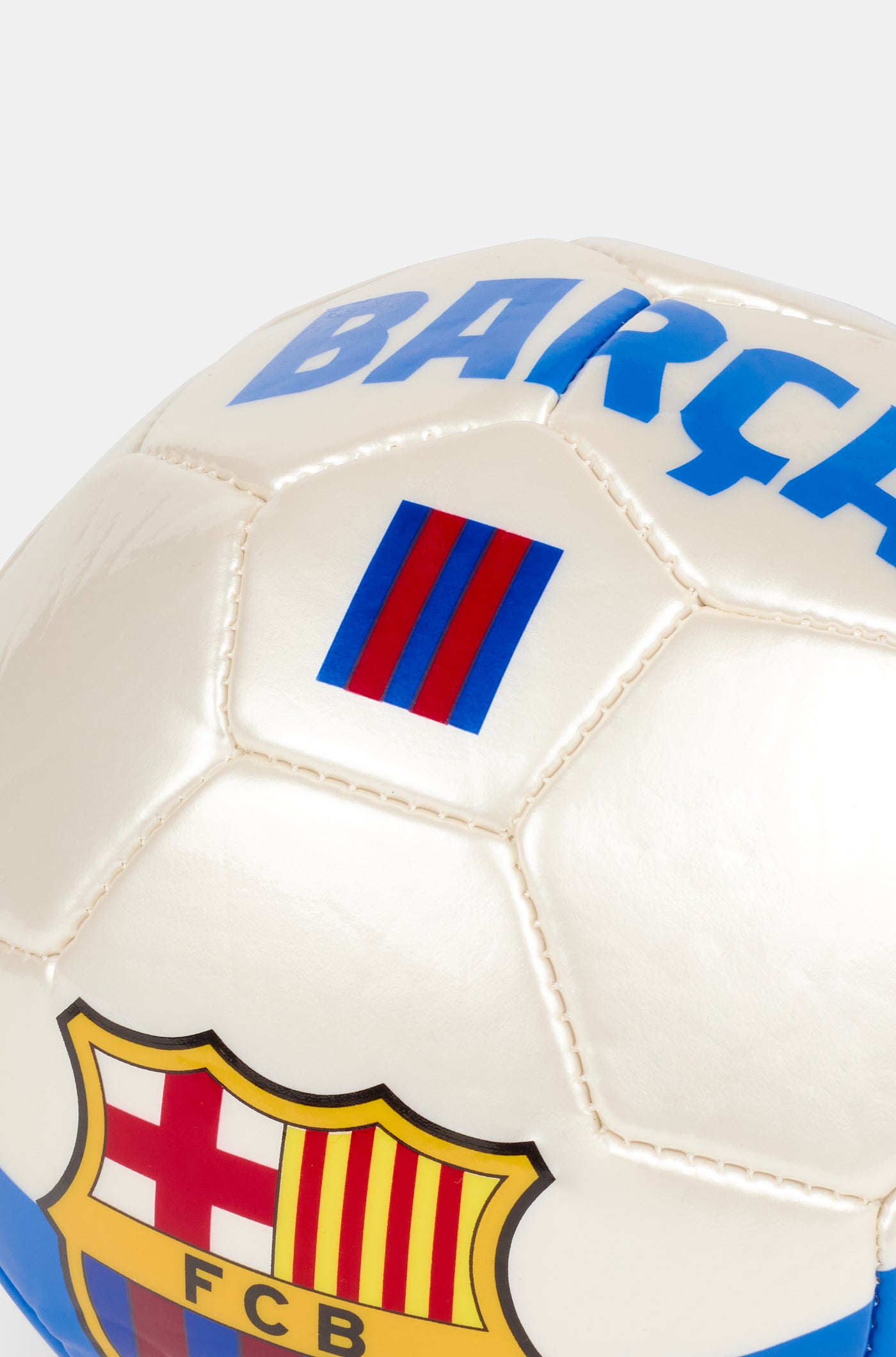 White football with blue and red stripes, featuring a large FC Barcelona crest in the center
