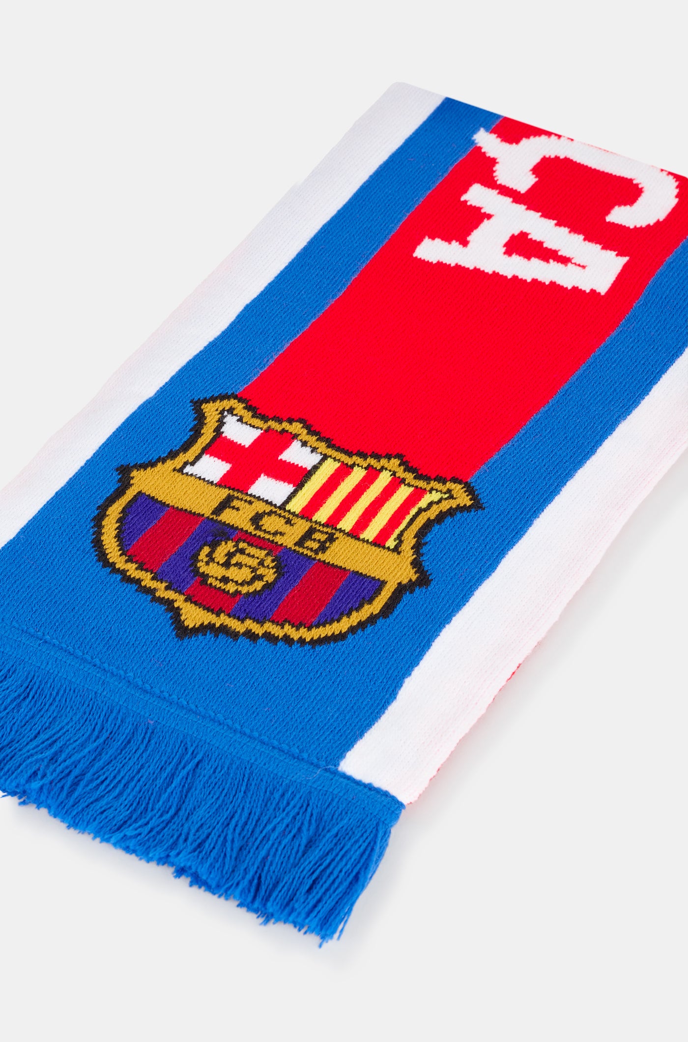 Red and blue FC Barcelona scarf with the club crest at both ends and the word 'BARÇA' in bold white letters in the center