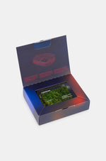 Rectangular acrylic display block encasing a preserved piece of grass from FC Barcelona's stadium. The block is engraved with the text "FC BARCELONA", "2022 / 2023", and "LA DARRERA GESPA DE L'ESTADI, FONT CAMP NOU", commemorating the last season played at the historic Camp Nou before renovations.
