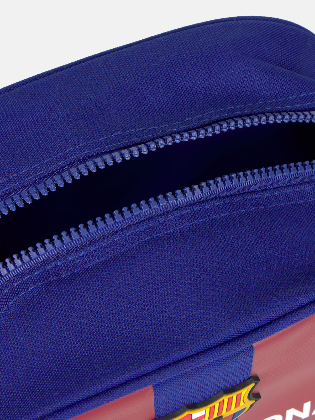 Blue and maroon striped toiletry bag with the FC Barcelona crest and 'FC BARCELONA' text on the front