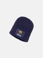 Dark blue knit beanie with a patch featuring the FC Barcelona crest and the word 'BARÇA' embroidered in white.