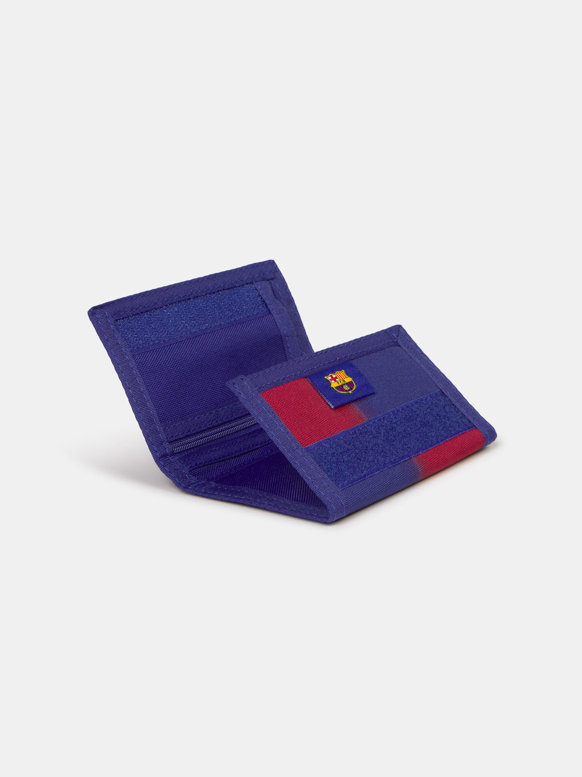 Blue and red fabric wallet with yellow 'Barça' text, displayed in FC Barcelona branded packaging