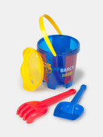 Barça-themed beach toy set including a blue bucket, yellow sifter, red rake, and blue shovel.