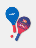 Blue and red paddle and ball beach set with Barça crest.

