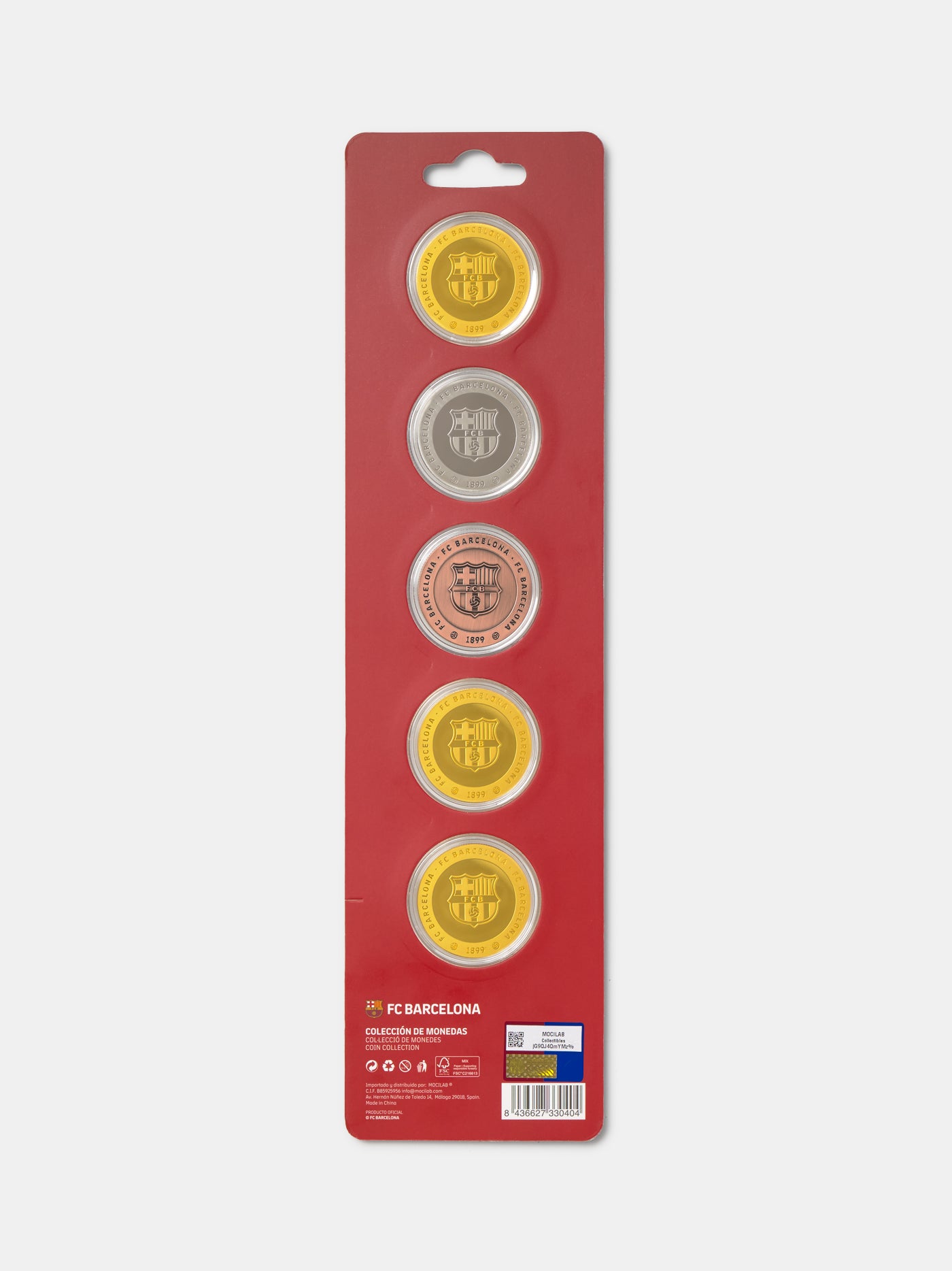 Packaged coins with FC Barcelona logo on a red background