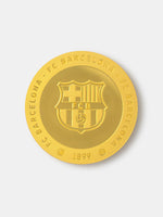 Gold coin with FC Barcelona logo on a white background