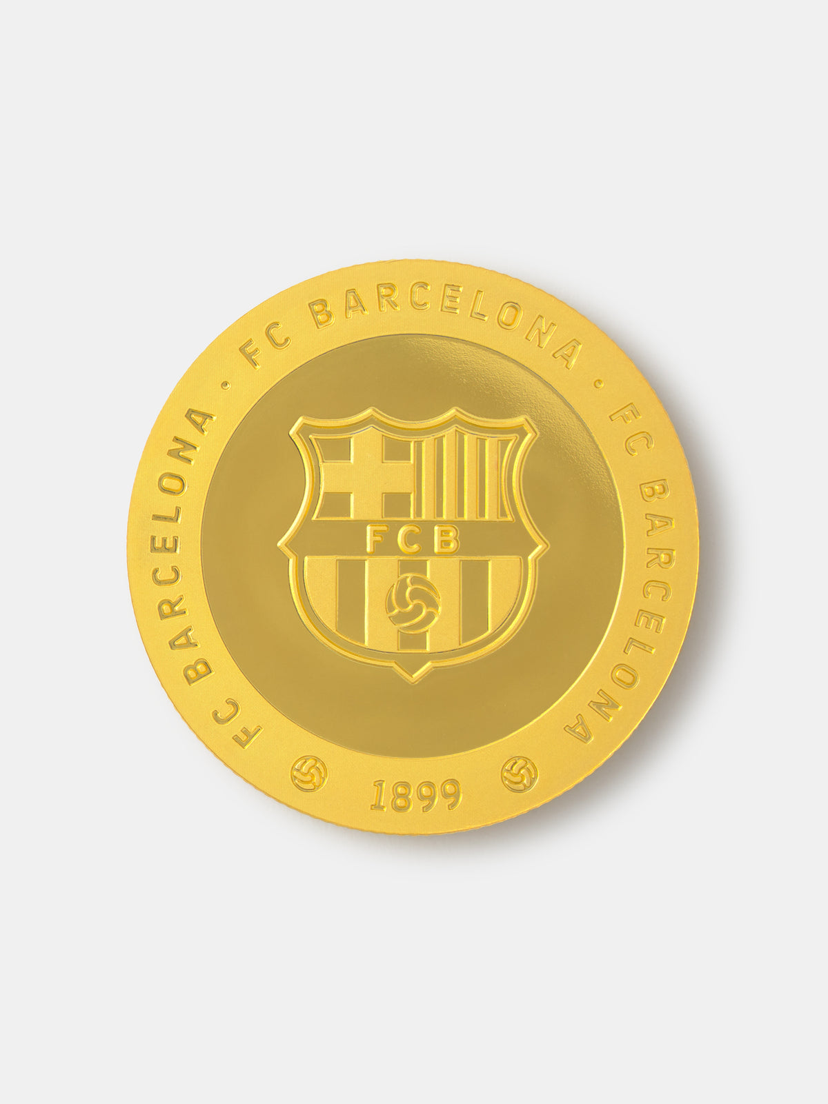 Gold coin with FC Barcelona logo on a white background