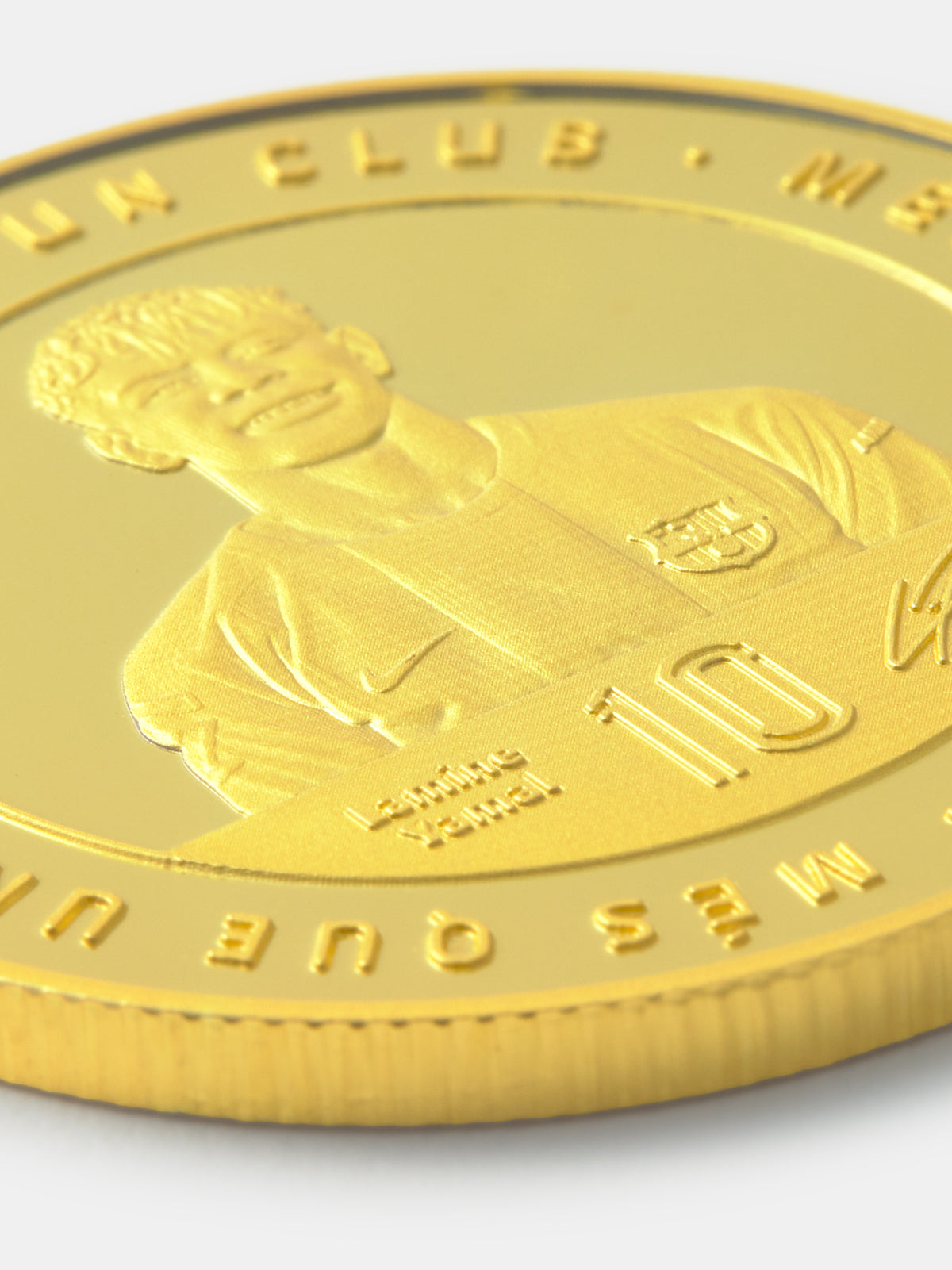 Gold coin with a portrait and number embossed on a white background