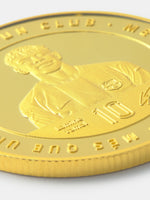 Gold coin with a portrait and number embossed on a white background