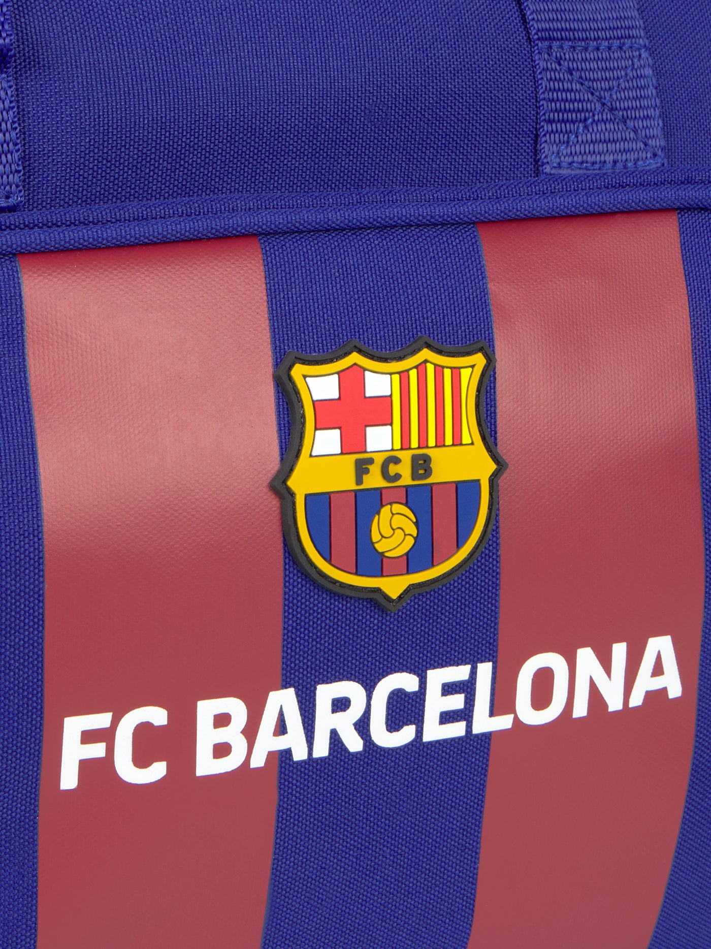 Blue and maroon striped sports duffle bag featuring the FC Barcelona crest and 'FC BARCELONA' text on the front pocket.
