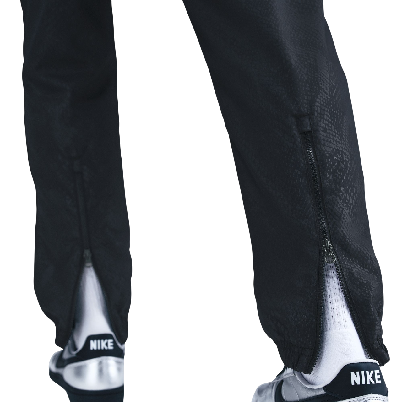 Black FC Barcelona training pants featuring the Kobe Bryant logo and 'FC Barcelona' text in purple on the right thigh.