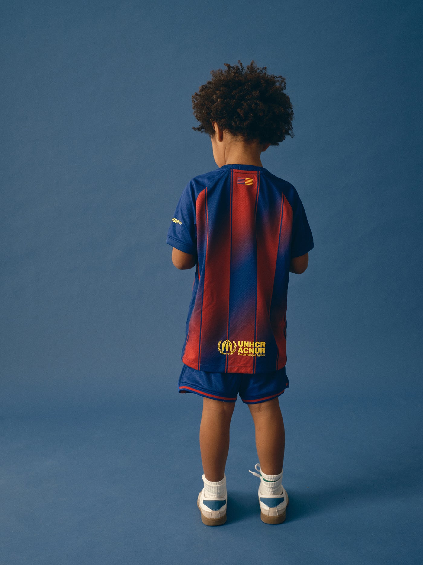 FC Barcelona home kit with blue and red vertical stripes, featuring the club crest, Nike logo, Spotify sponsor, and matching shorts.