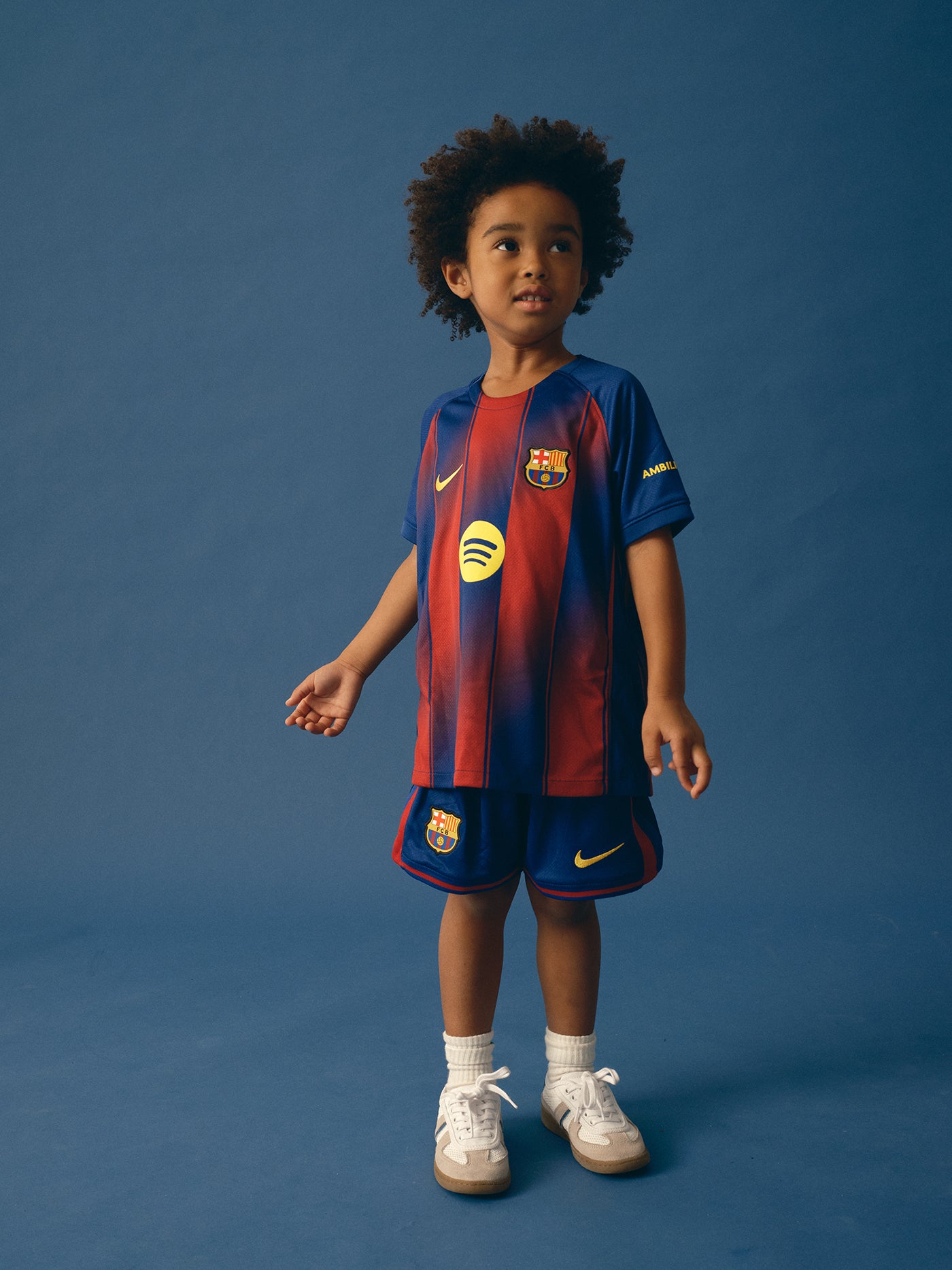 FC Barcelona home kit with blue and red vertical stripes, featuring the club crest, Nike logo, Spotify sponsor, and matching shorts.