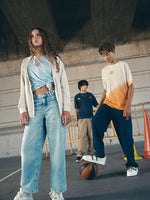 navy blue FC Barcelona sweatpants featuring the club crest in orange on the thigh