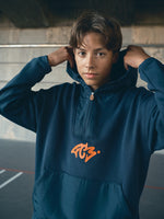 navy blue FC Barcelona hoodie featuring a front zipper and an orange graffiti-style 'FCB' logo printed on the chest
