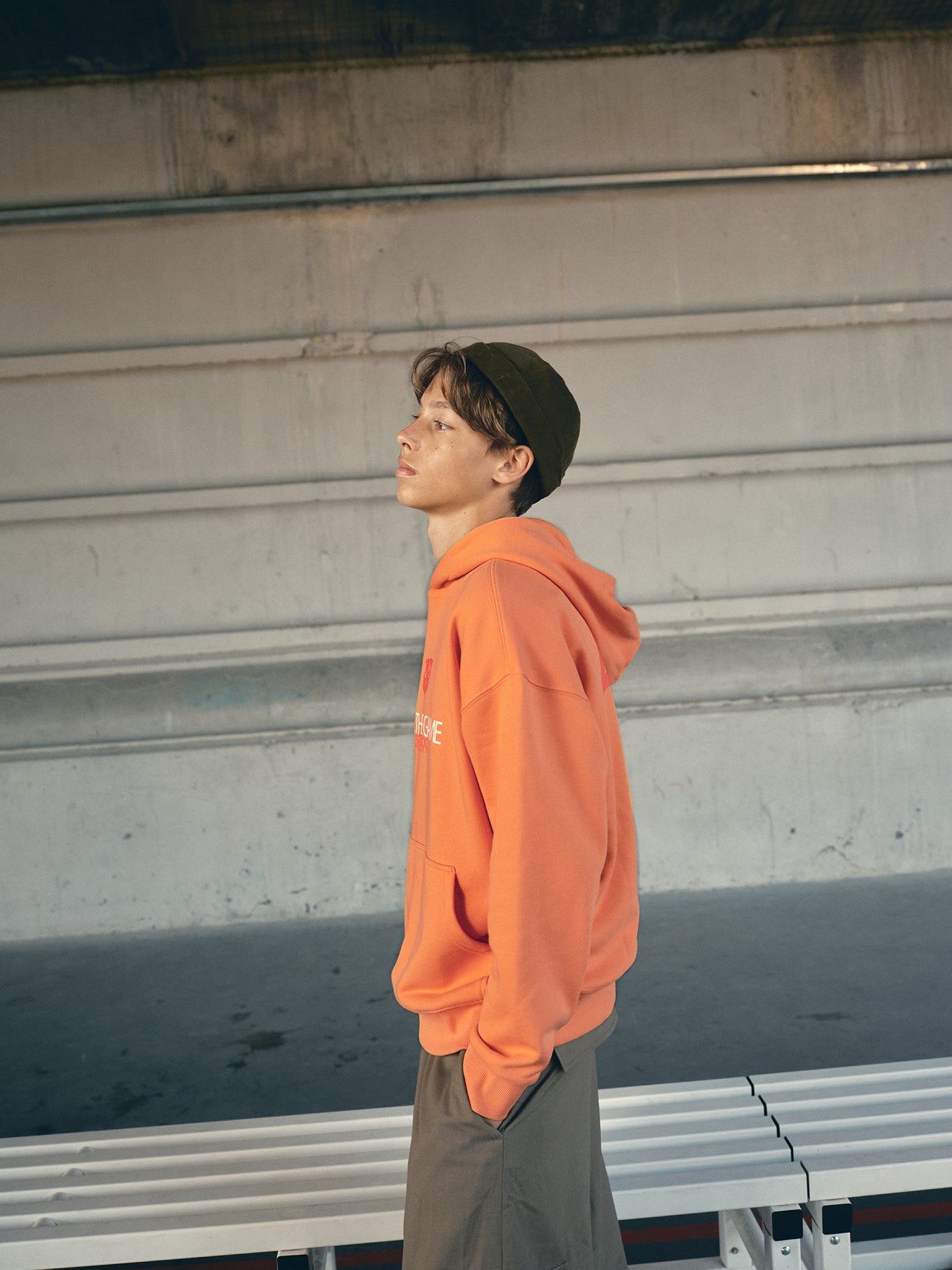 Orange FC Barcelona hoodie featuring the club crest and the slogan 'Live the Game EST. 1899' printed on the front.