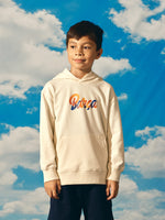 Beige FC Barcelona hoodie for kids, featuring a colorful 'Barça' text on the front and 'Futbol Club Barcelona - Tots units fem força' with the club crest on the back