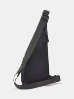 Black FC Barcelona crossbody bag with multiple zippered compartments and metallic club crest on the front pocket.