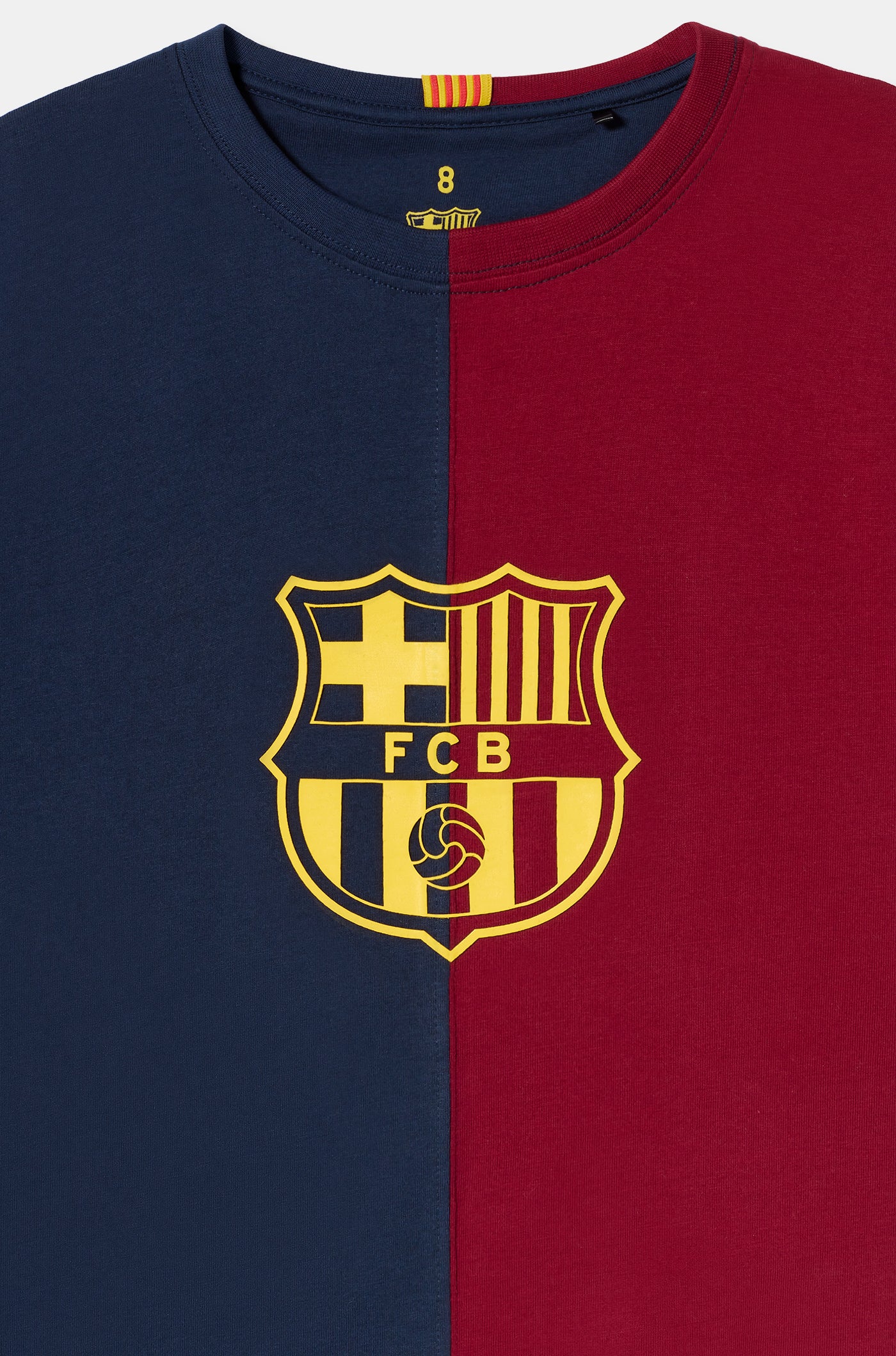 half navy and half red FC Barcelona t-shirt with a large vintage-style club crest in the center.