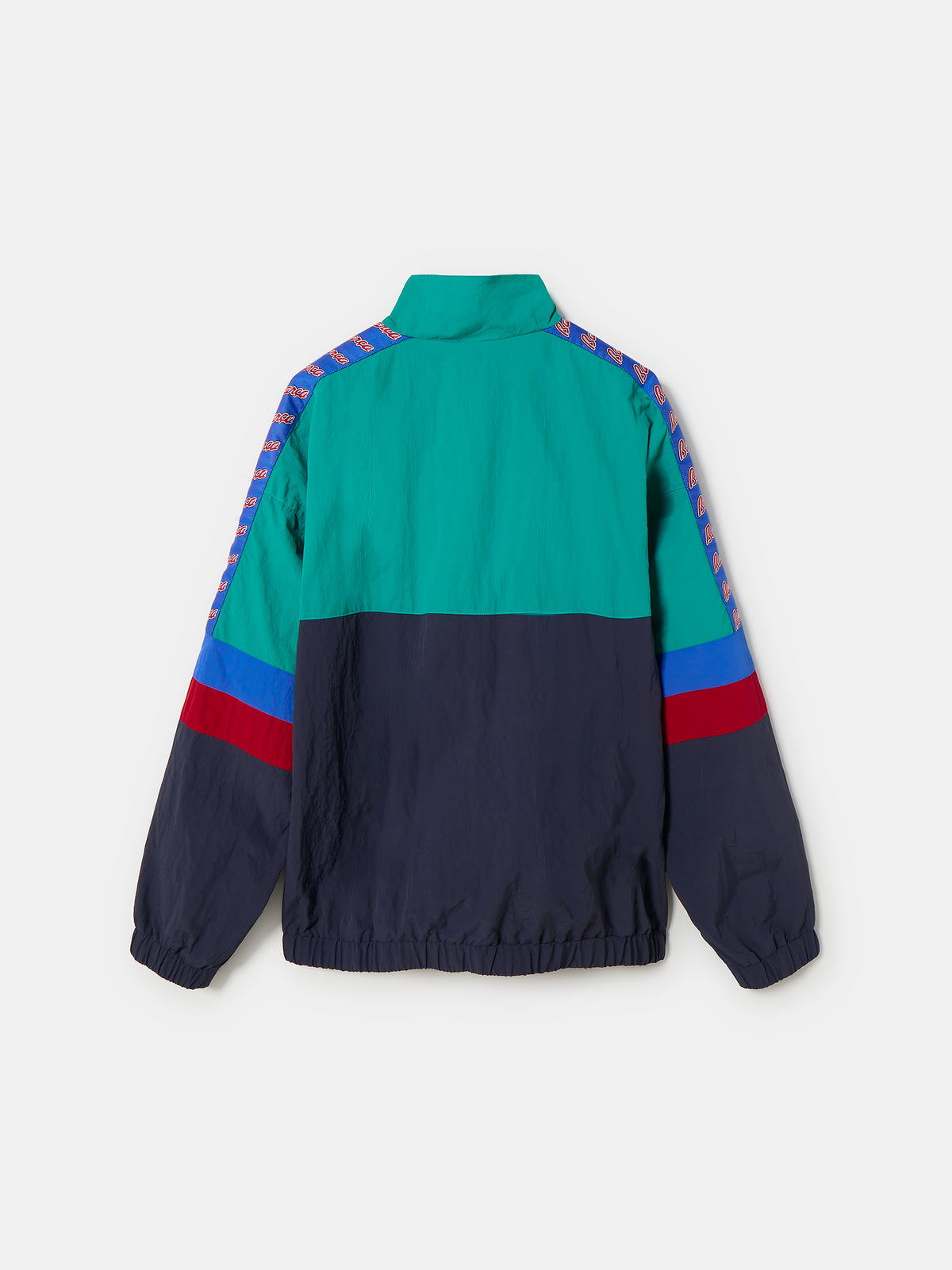 Retro-style windbreaker in teal, red, blue, and navy with FC Barcelona crest and embroidered 'Barça' text on the chest.