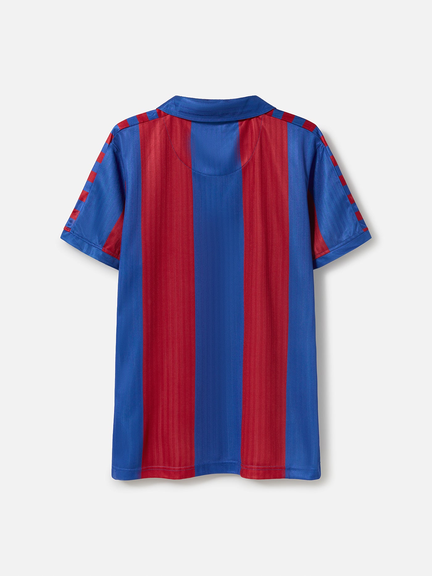 Man wearing a retro-style FC Barcelona jersey with wide vertical red and blue stripes, featuring the club's crest on the left chest and a classic V-neck collar design.
