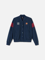 Navy blue FC Barcelona bomber jacket with red bands on the sleeves. The jacket features the club crest on the left chest and the year "1899" on the right chest, with a front snap button closure and ribbed cuffs and hem.