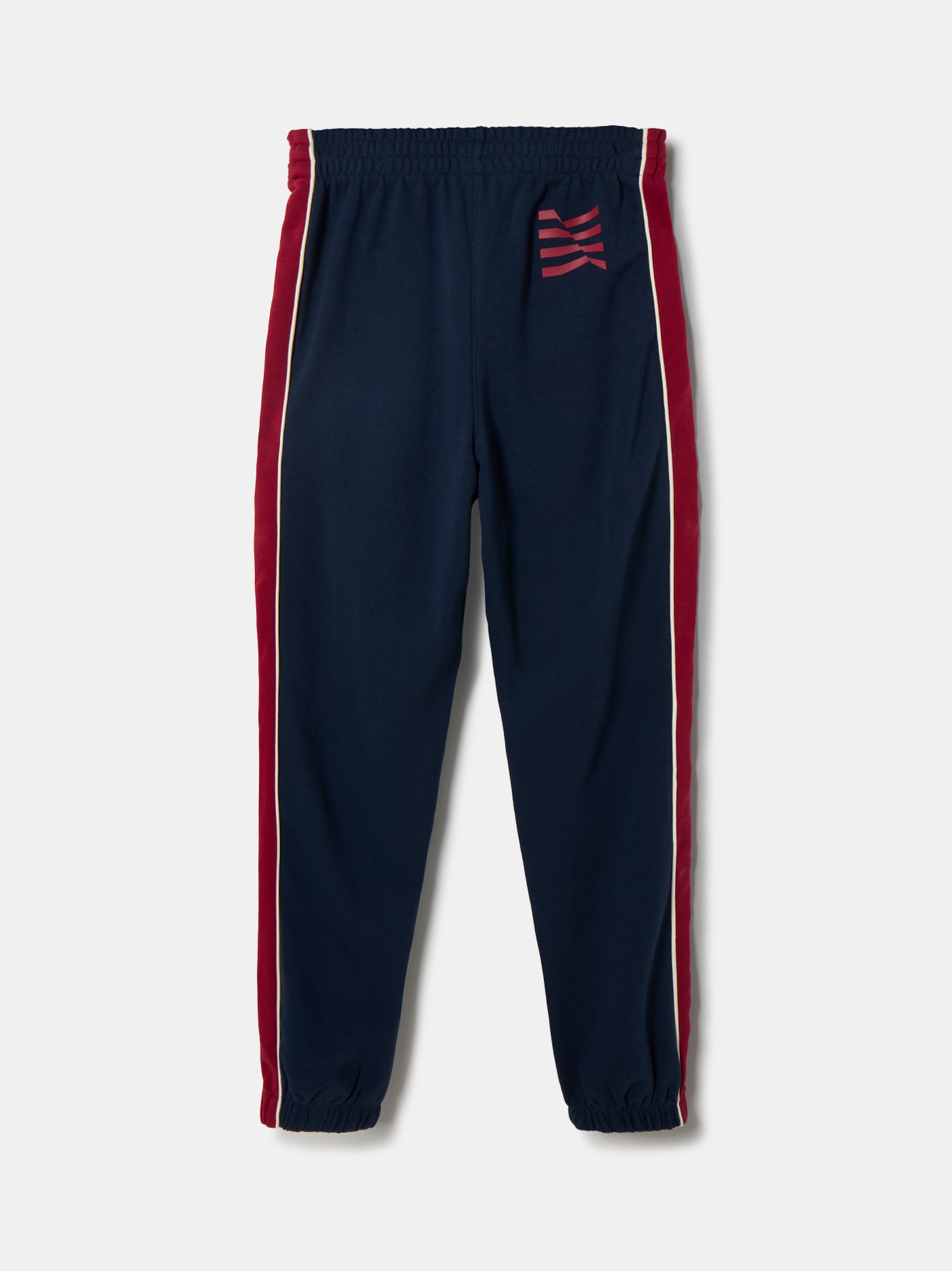 Navy blue FC Barcelona track pants with red side panels and white piping. The pants feature the club crest on the upper left leg and have an elastic waistband and cuffs for a comfortable fit.






